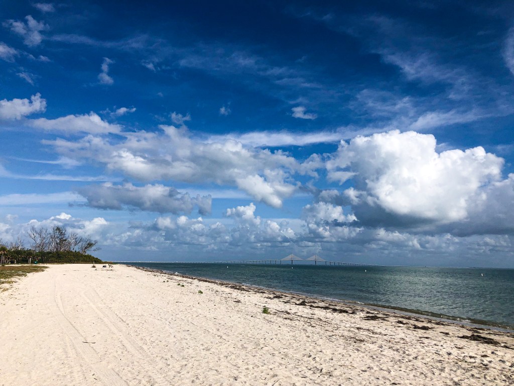 east beach with sunshine skyway in the very background 