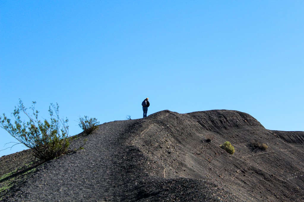 Mom walking ahead on the Ubehebe Crater rim trail
